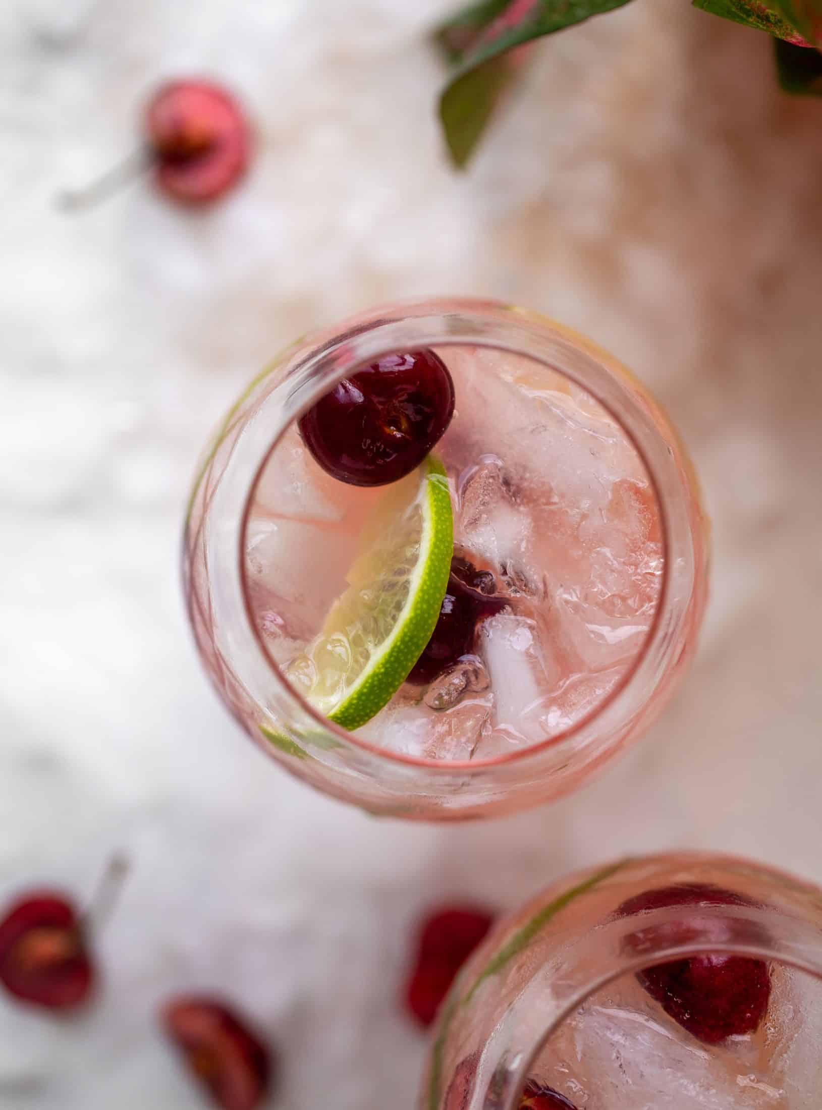 close up cherry lime gin and tonic
