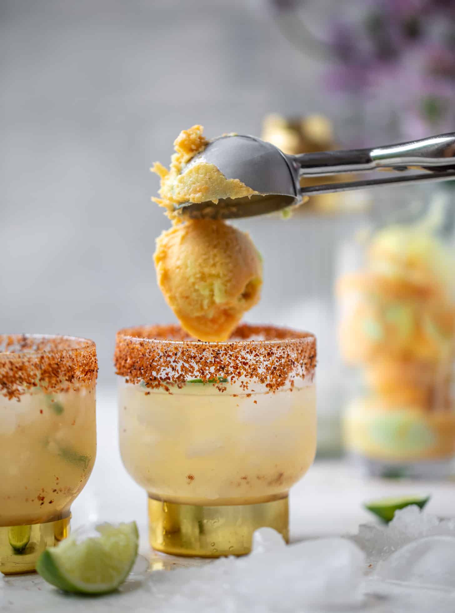 dropping sherbet into a margarita