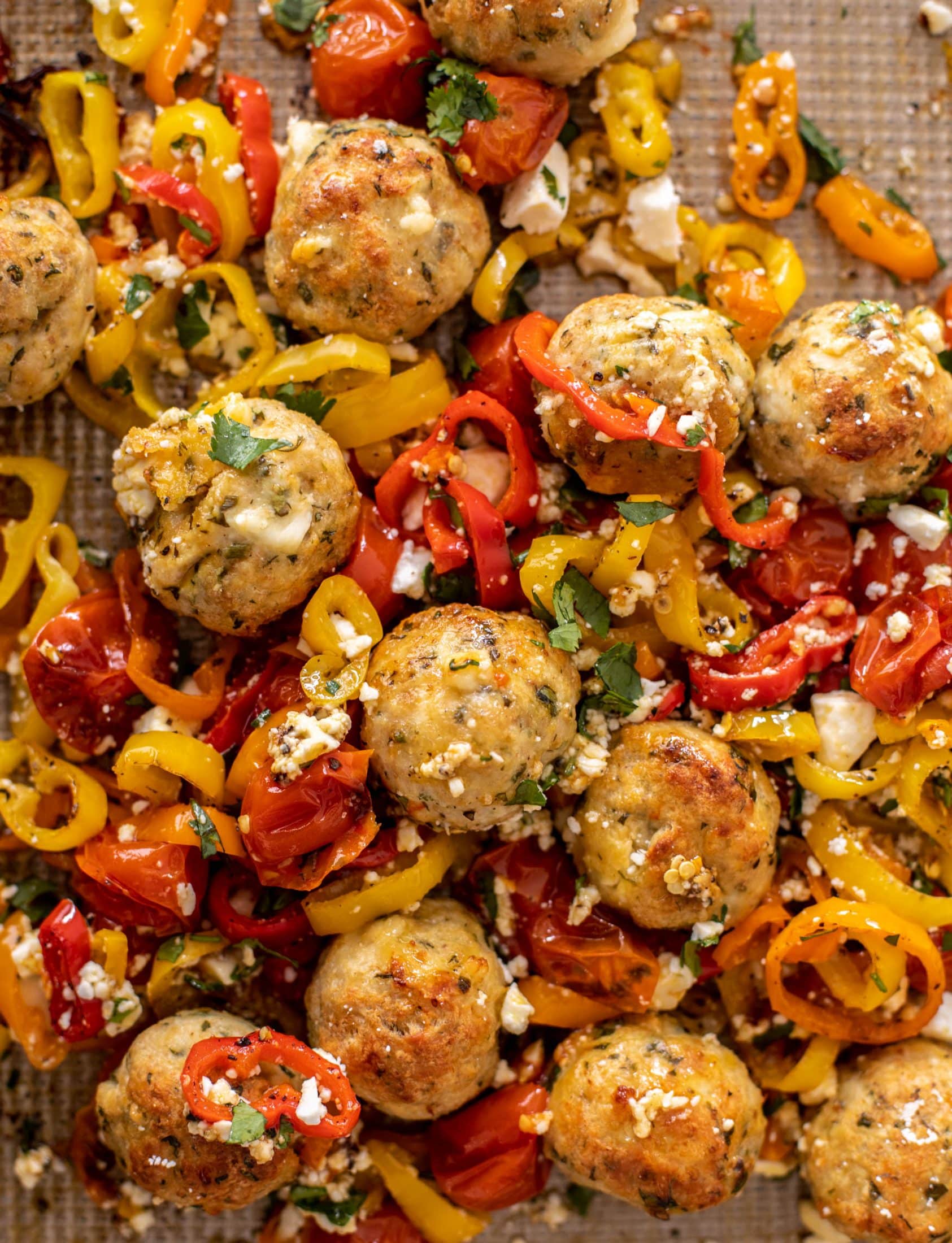 sheet pan chicken meatballs with tomatoes and feta